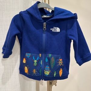 The North Face Blue Sweatshirt with Playful Patterns